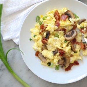 Scrambled eggs with bacon and mushrooms